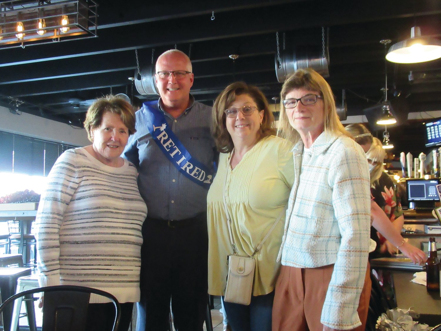 STAFF SENDOFF: Among the many people who helped make Dave Cournoyer’s special retirement sendoff special were Martha Taylor, previous employee and one-time School Committee Secretary; Angela Brasil, administrative assistant to Dr. DiLullo and School Committee Member MarySue Andreozzi.